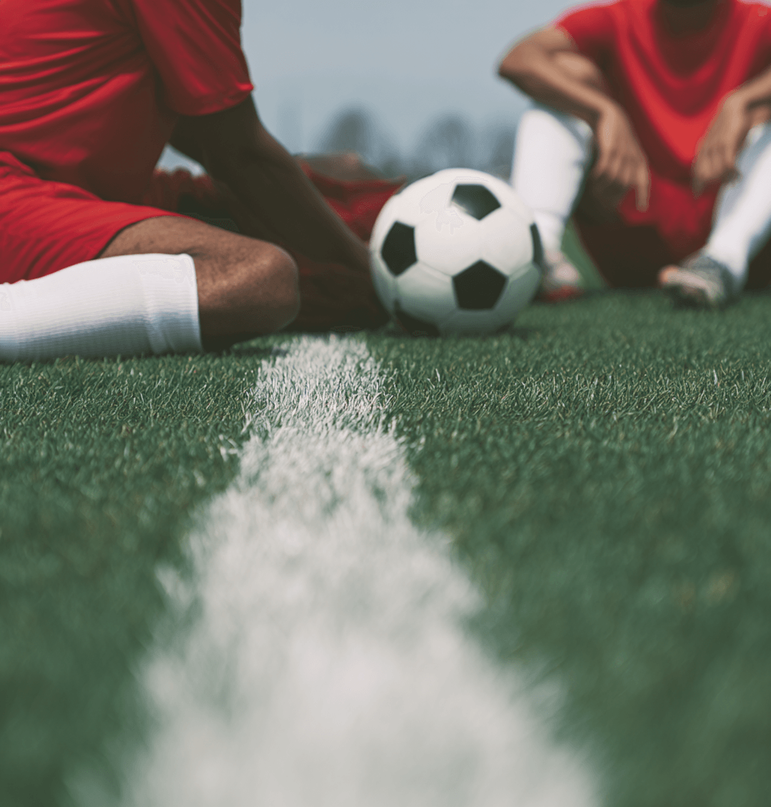 Ball on the grass line during a small-sided game